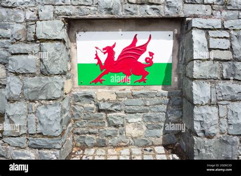 The Welsh Dragon symbol set on a grey slate wall in Wales Stock Photo ...