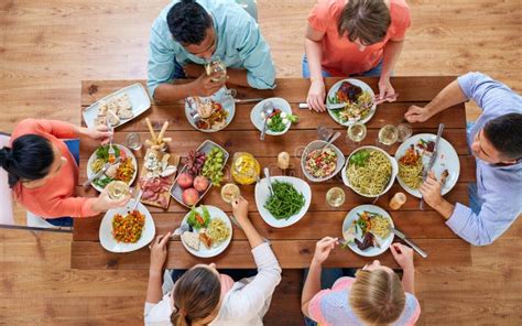 Group of People Eating at Table with Food Stock Image - Image of lifestyle, dining: 107904347