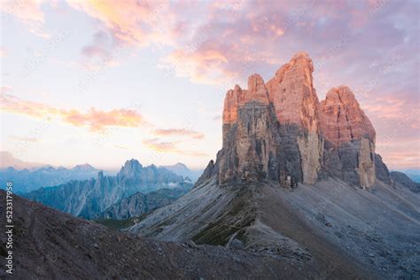 Stunning view of the Three Peaks of Lavaredo, (Tre cime di Lavaredo) during a beautiful sunrise ...