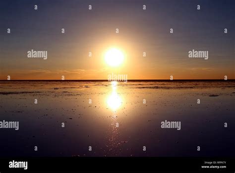 Reflection of the Famous Mirror effect at Sunset on Uyuni Salt Flats or Salar de Uyuni in ...