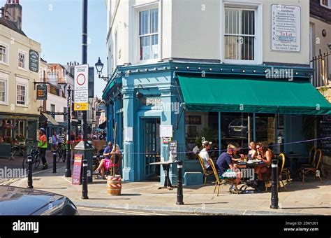 People eating outside at Fagin's restaurant, on the corner of George street, Hastings, Old Town ...