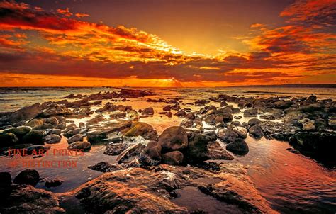 A Rocky Beach with an Orange Sunset Art Print | Sunset art, Ocean ...