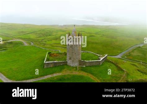 Doonagore Castle aerial foggy view, iconic landmark, one of the most ...