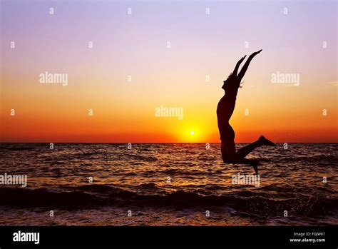 silhouette of a man at sunset Stock Photo - Alamy