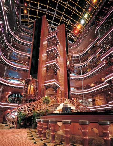 Share a cocktail as you take in Carnival Elation's eye-catching 6-story ...