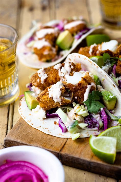 Crispy Baked Fish Tacos with Creamy Cilantro Lime Slaw - Modern Farmhouse Eats