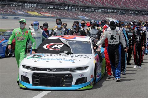 PHOTOS: NASCAR drivers come together to support Bubba Wallace before ...