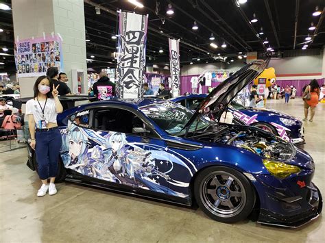 Eula's VA (Suzie Yeung) standing next to the Eula car 🚘 : r/Genshin_Impact