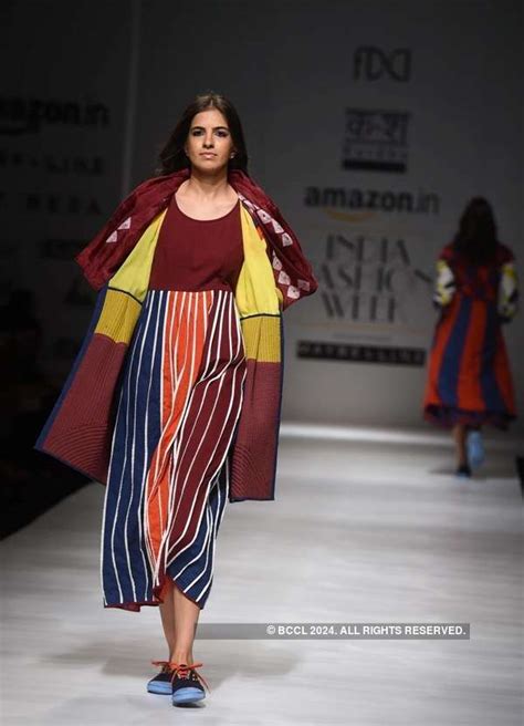 A model walks the ramp for designer Malini Ramani on day 3 of the Amazon India Fashion Week ...