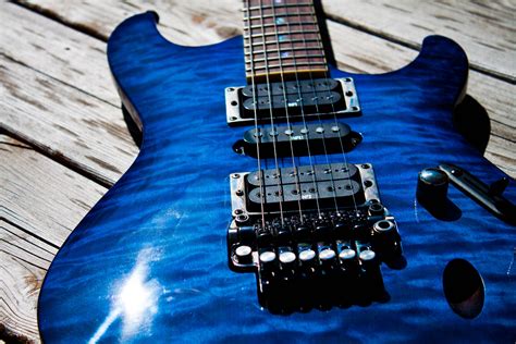 Blue electric guitar on wooden surface HD wallpaper | Wallpaper Flare