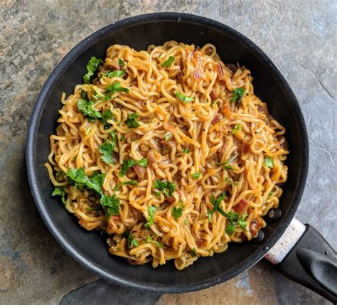 Street style maggi noodles are a spicy snack made by tossing maggi noodles in an onion tomato ...