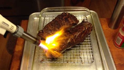 Searing sous vide cooked short ribs with a butane torch - YouTube