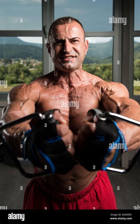 Chest Workout Cable Crossover In Gym Stock Photo - Alamy