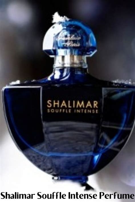 a bottle of shalimar perfume in front of a blurry background