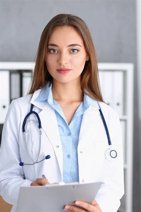 Beautiful Smiling Female Doctor Stand in Office Stock Photo - Image of ...