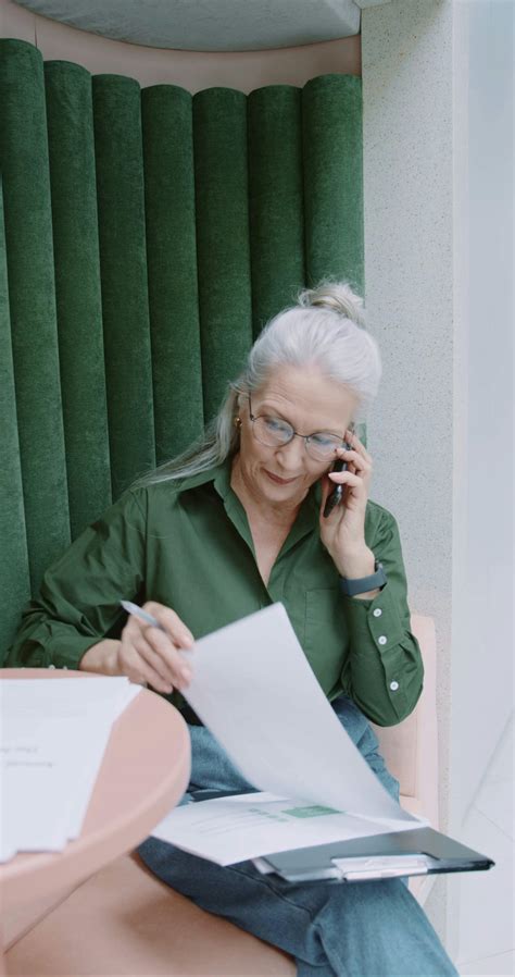 A Woman Looking At Some Paper Works · Free Stock Video