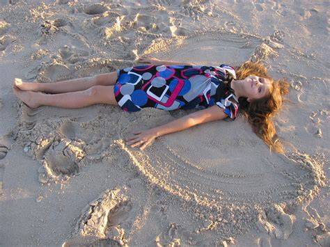 Making a sand angel | Tania | Flickr