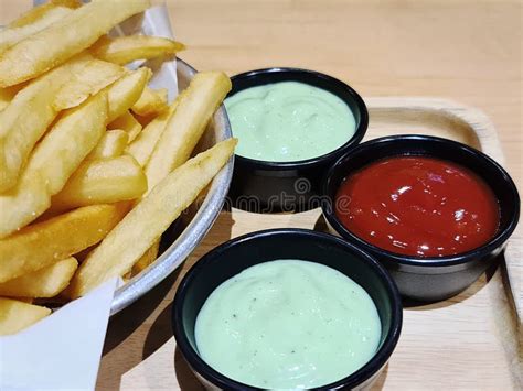 French Fries with Small Cups of Tomato and Wasabi Dipping Sauce Stock Image - Image of gold ...