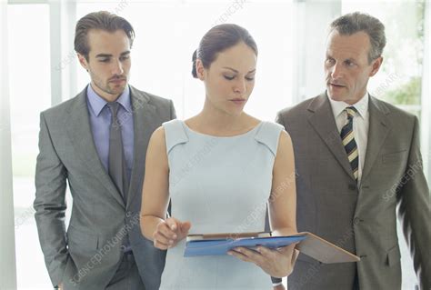 Business people talking in office - Stock Image - F014/1501 - Science Photo Library