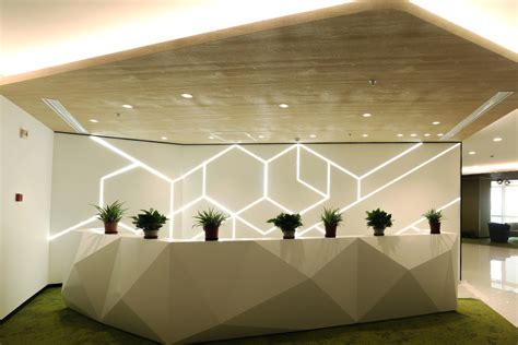 DuPont Tedlar Wallcoverings Corteva Corporate Office Reception Desk Lighting and Suspended Wall ...