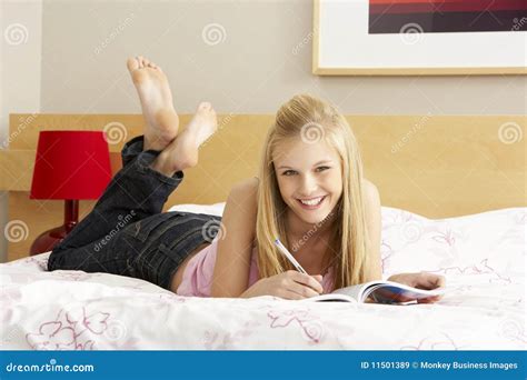 Teenage Girl Writing in Diary in Bedroom Stock Image - Image of colour, laying: 11501389
