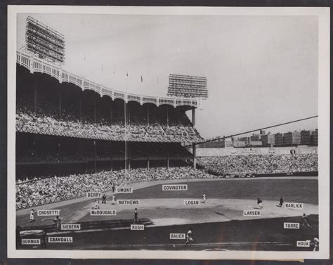 an old black and white photo of a baseball stadium with many people in the stands