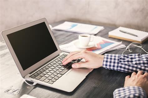 Premium Photo | Man typing on laptop