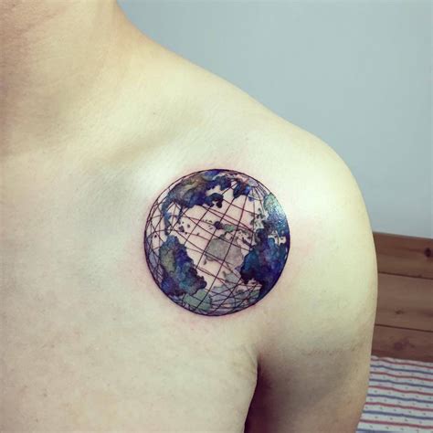 Planet earth tattoo on the left shoulder.