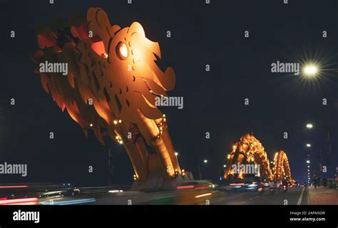 Dragon bridge night light in danang, vietnam Stock Photo - Alamy