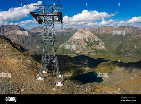 Aerial view of the valley Val Bernina and the road to Bernina Pass ...