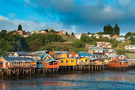 Stilt Houses In River Against Sky stock photo