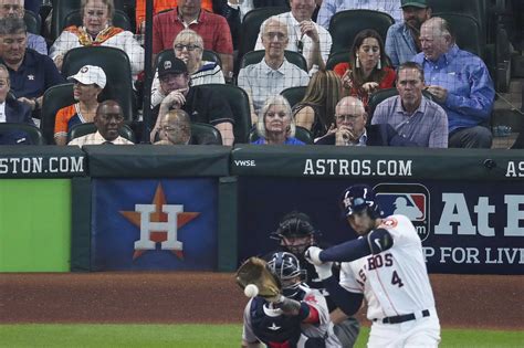 Three Hall of Famers sitting behind home plate at Astros game