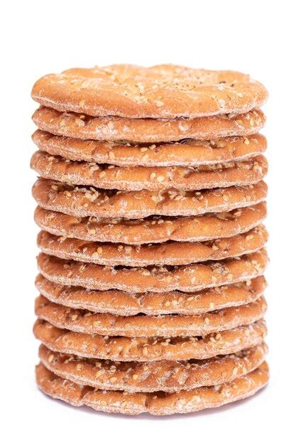 Premium Photo | A stack of round salt crackers with sesame isolated on ...