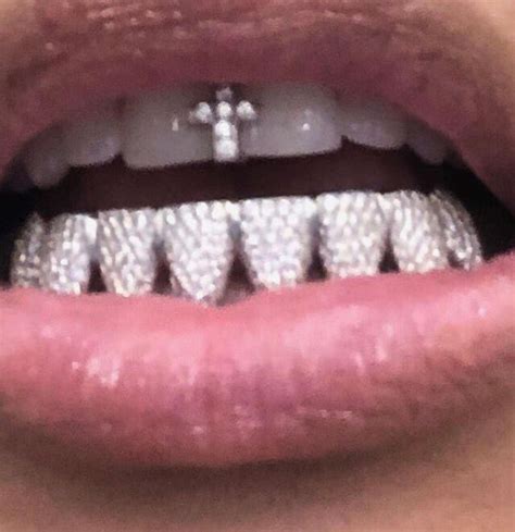 Kim Kardashian Shows Off New Flashy Diamond Cross Grill