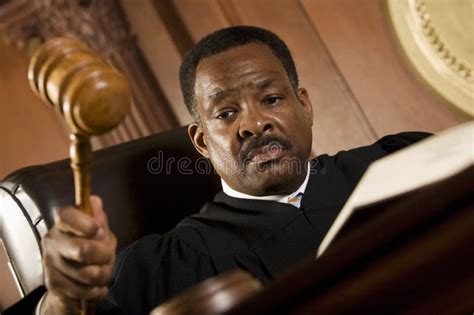 Judge Knocking Gavel in Courtroom Stock Image - Image of looking, gavel: 29663117