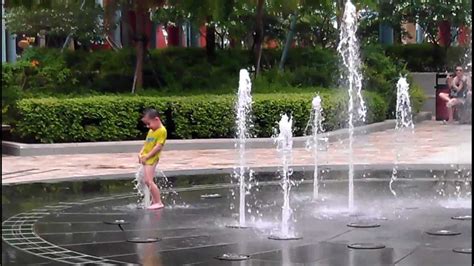 Funny kid playing in the water fountain - YouTube