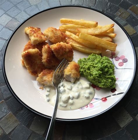 Fish bites and chips with mushy peas and homemade tartare sauce - a ...