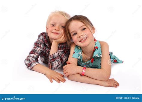 Children Smiling Whilst Lying Down. Stock Photos - Image: 25611363