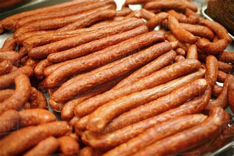 Smoked Hungarian Sausages on Display at Market - Stock Photo - Dissolve