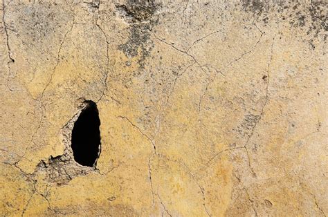 Hole In Yellow Concrete Wall Free Stock Photo - Public Domain Pictures