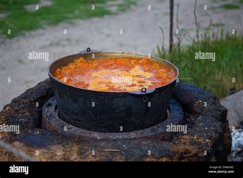 Large cauldron with a fluffy soup on the street Stock Photo - Alamy