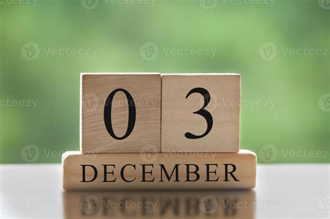 December 3 text on wooden blocks with blurred nature background. Copy ...