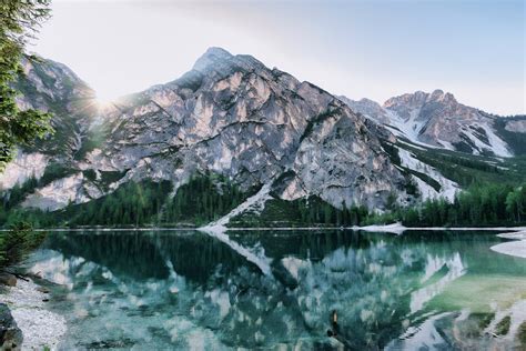 Lake and Mountain Under White Sky · Free Stock Photo