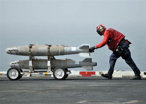 Aviation Ordnanceman moving Mk-82 munitions on the USS Abraham Lincoin. | Navy carriers ...