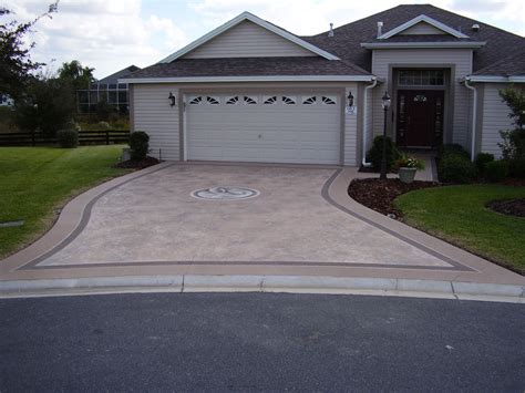 Custom decorative concrete overlay enhances this driveway for a long-lasting surface. | Concrete ...