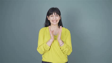 Woman clapping excitedly to camera. 33087438 Stock Video at Vecteezy