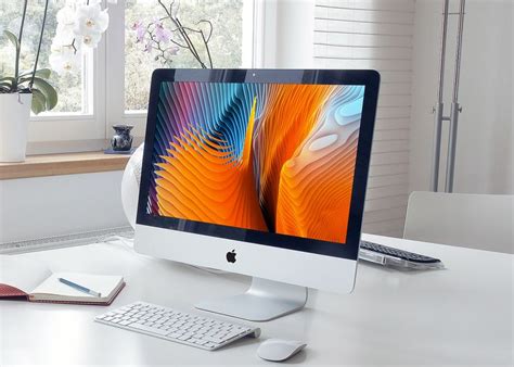 an apple desktop computer sitting on top of a white desk