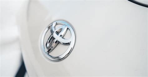 Close-up of the Logo on a White Toyota · Free Stock Photo