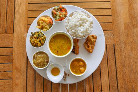 Best assamese thali in kazirang Stock Photo by wirestock | PhotoDune