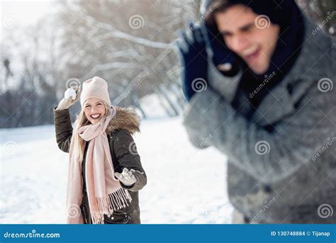 Two Young People Enjoying in the Snow Stock Photo - Image of hugging, cute: 130748884